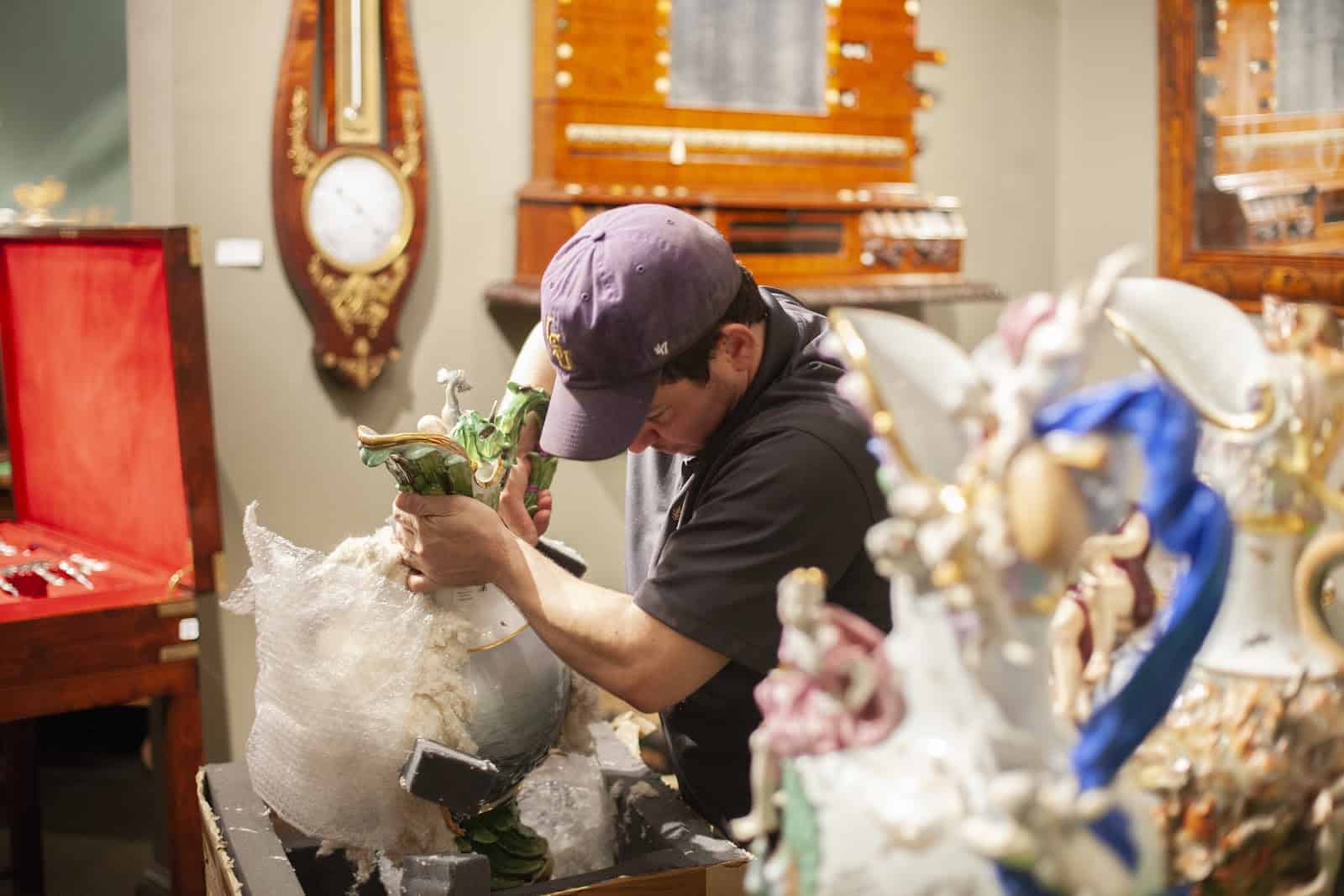 Man Removing China from Packaging